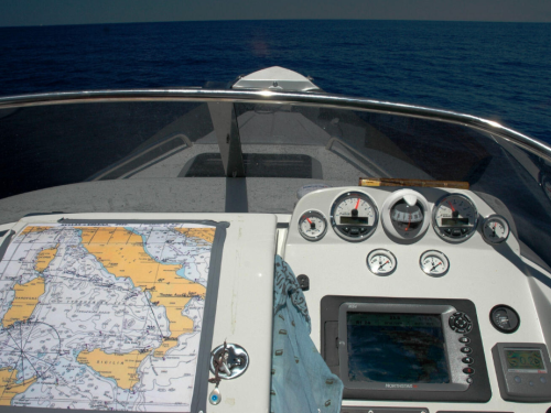 Boat helm, nautical chart on boat, boat dash