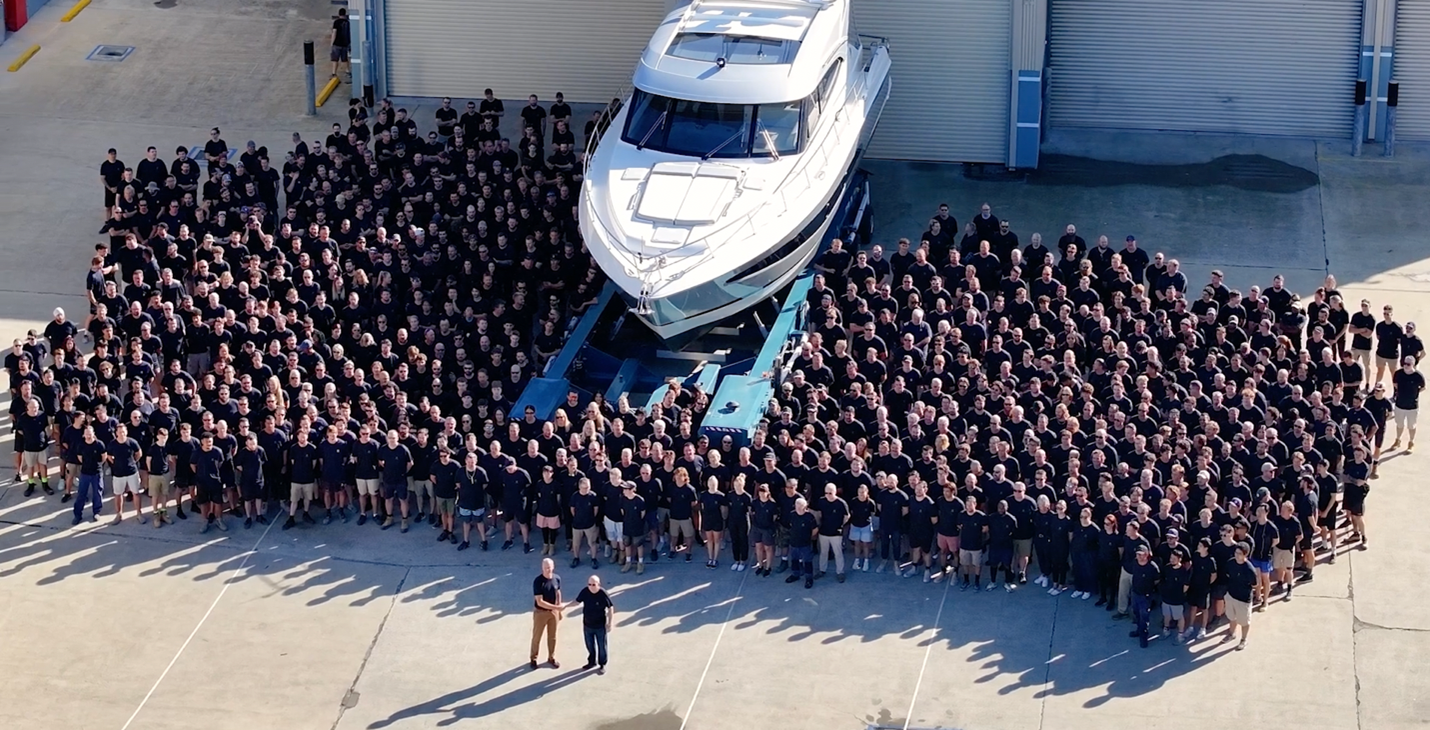 Riviera's CEO Rodney Longhurst thanks Peter Haig for buying the company’s 6,000th boat.