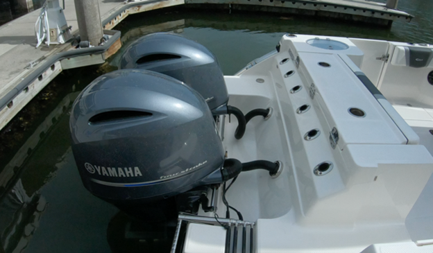 Our test boat was powered by twin 150-hp Yamaha outboards. Notice that the forward end of the splashwell and the transom are angled to ensure that the engines can fully tilt out of the water