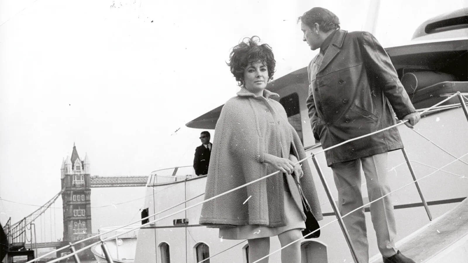 Richard Burton and Elizabeth Taylor boarding a boat