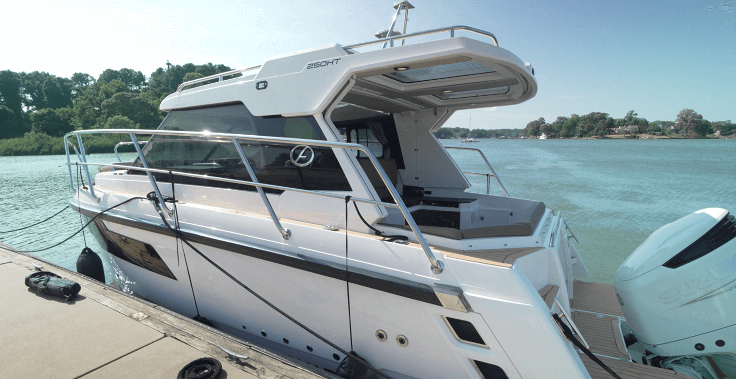 Aquador 250 HT dockside image clearly shows how far aft the hardtop extends 