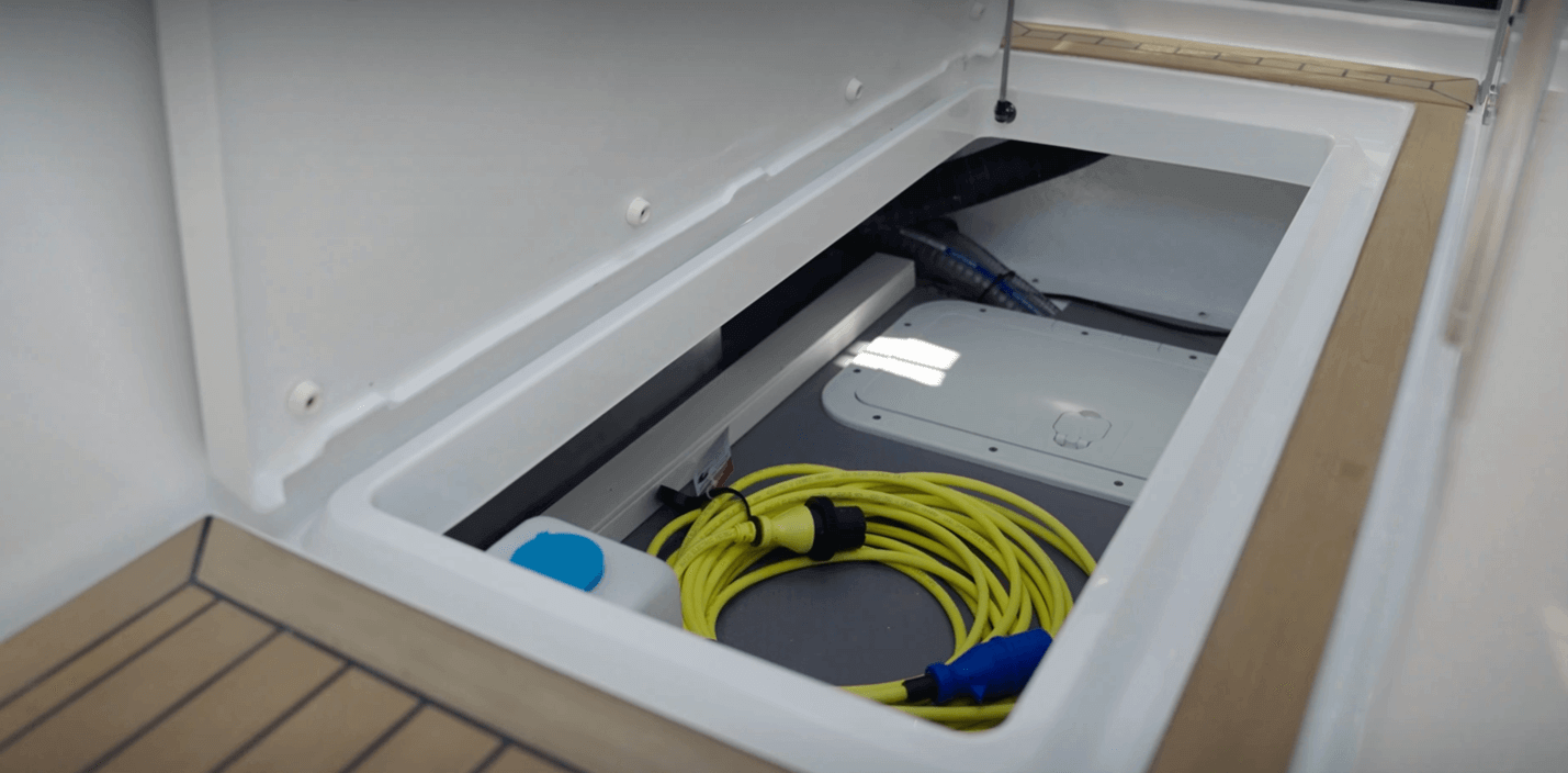 Aquador 250 HT storage space in the cockpit sole