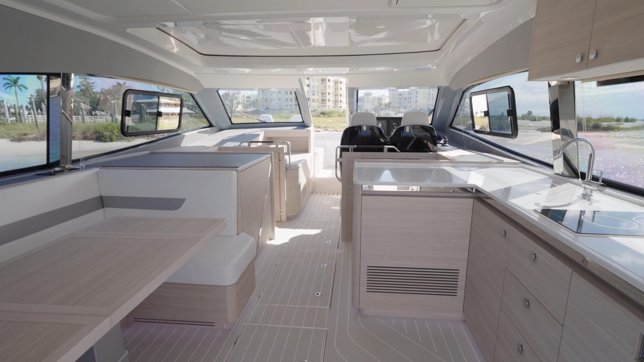 Aquila 42 Coupe Power Catamaran salon area surrounded by large windows