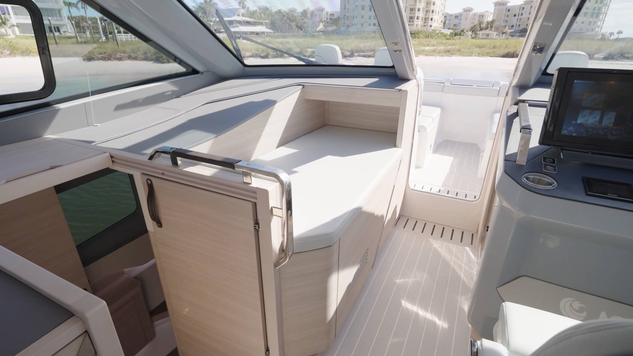 Aquila 42 Coupe Power Catamaran seating near helm console