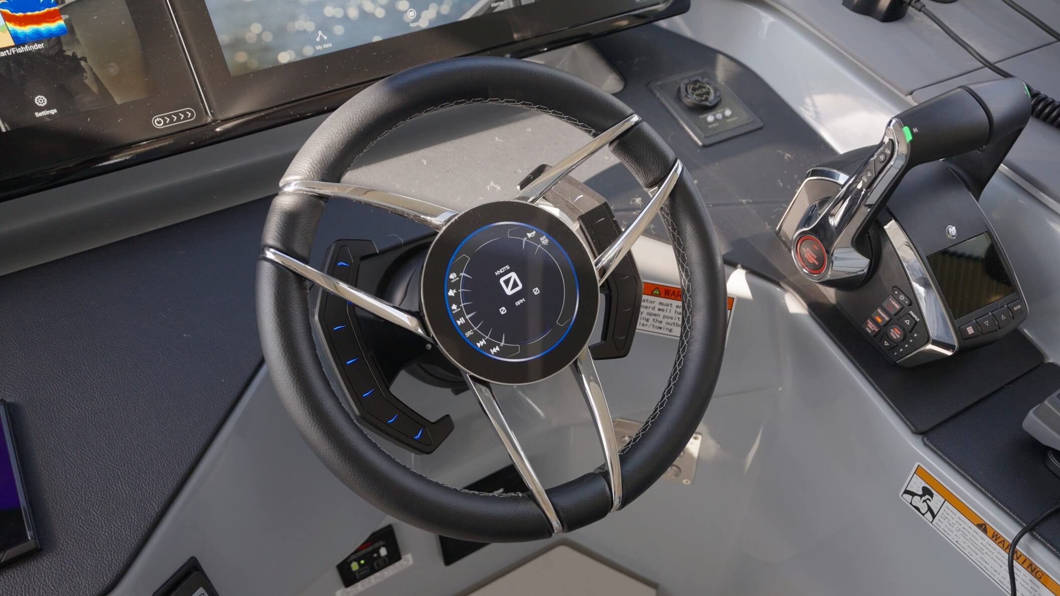 Aquila 42 Coupe Power Catamaran steering wheel with screen in the middle