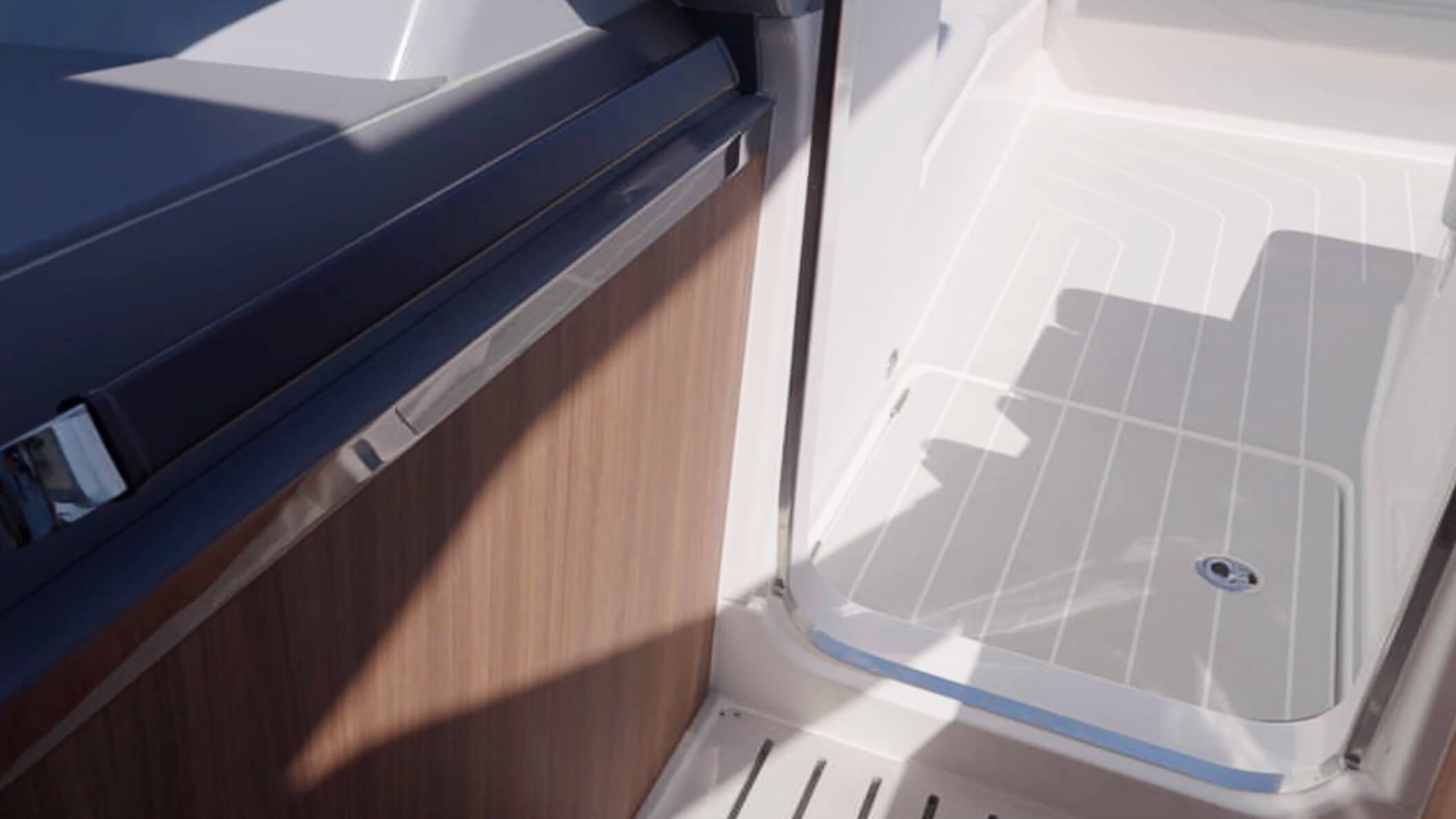 Aquila 46 Coupe Power Catamaran additional storage is found in this deck hatch just outside the doorway to the bow