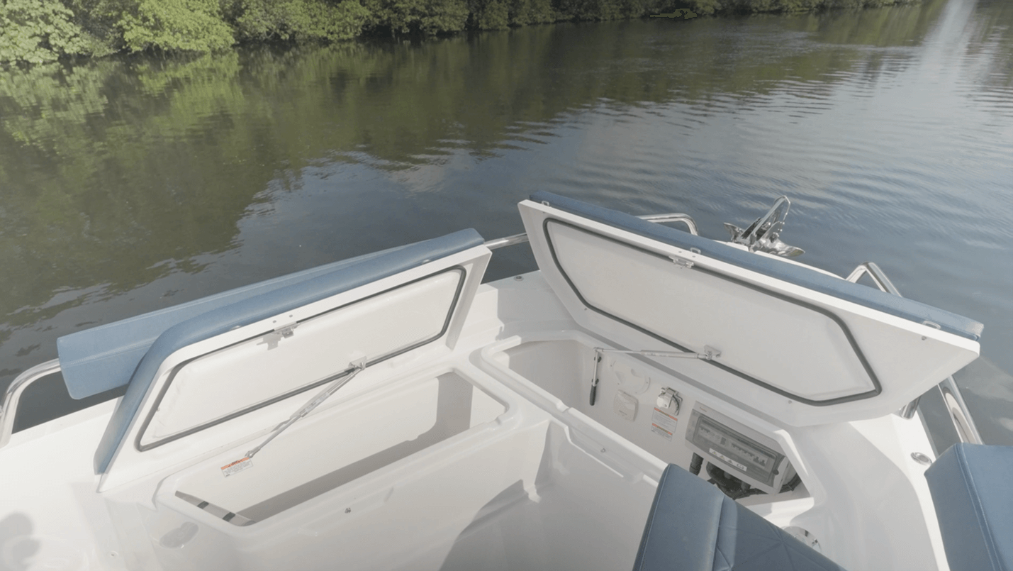 Axopar 29 Sun Top Large storage compartments are located under the seat cushions