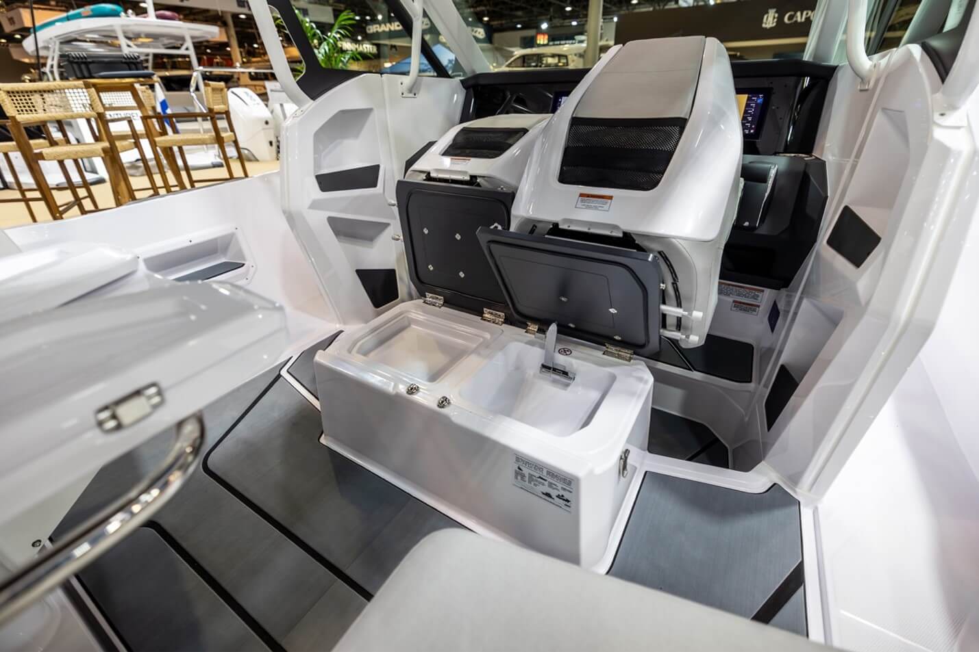 Axopar 29 Sun Top This neat touch has the twin helm seats tilting forward to uncover a wet bar and storage in the base