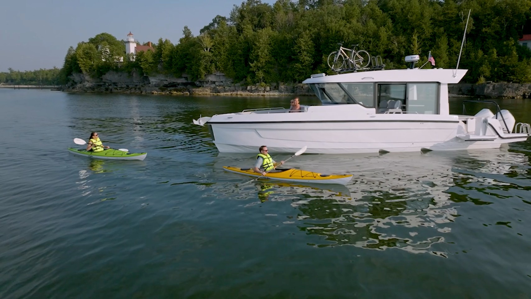 Cruisers 38 VTR EC anchored, kayaks nearby