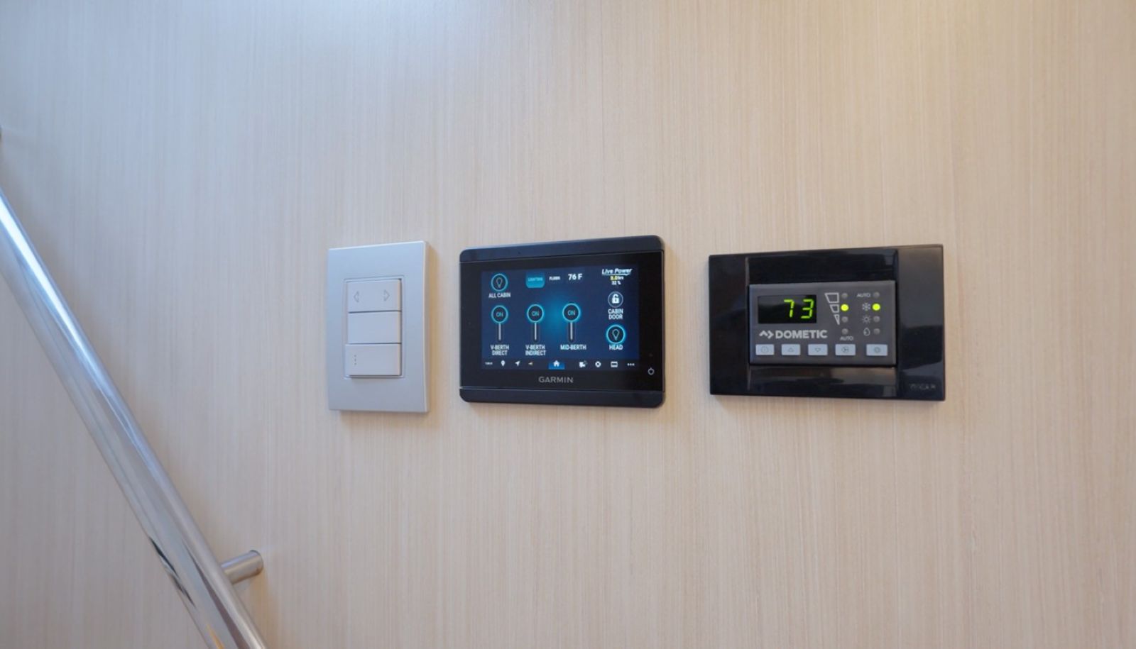 Regal LX43 lighting and ac control panels mounted on the bulkhead leading down into the living accommodations