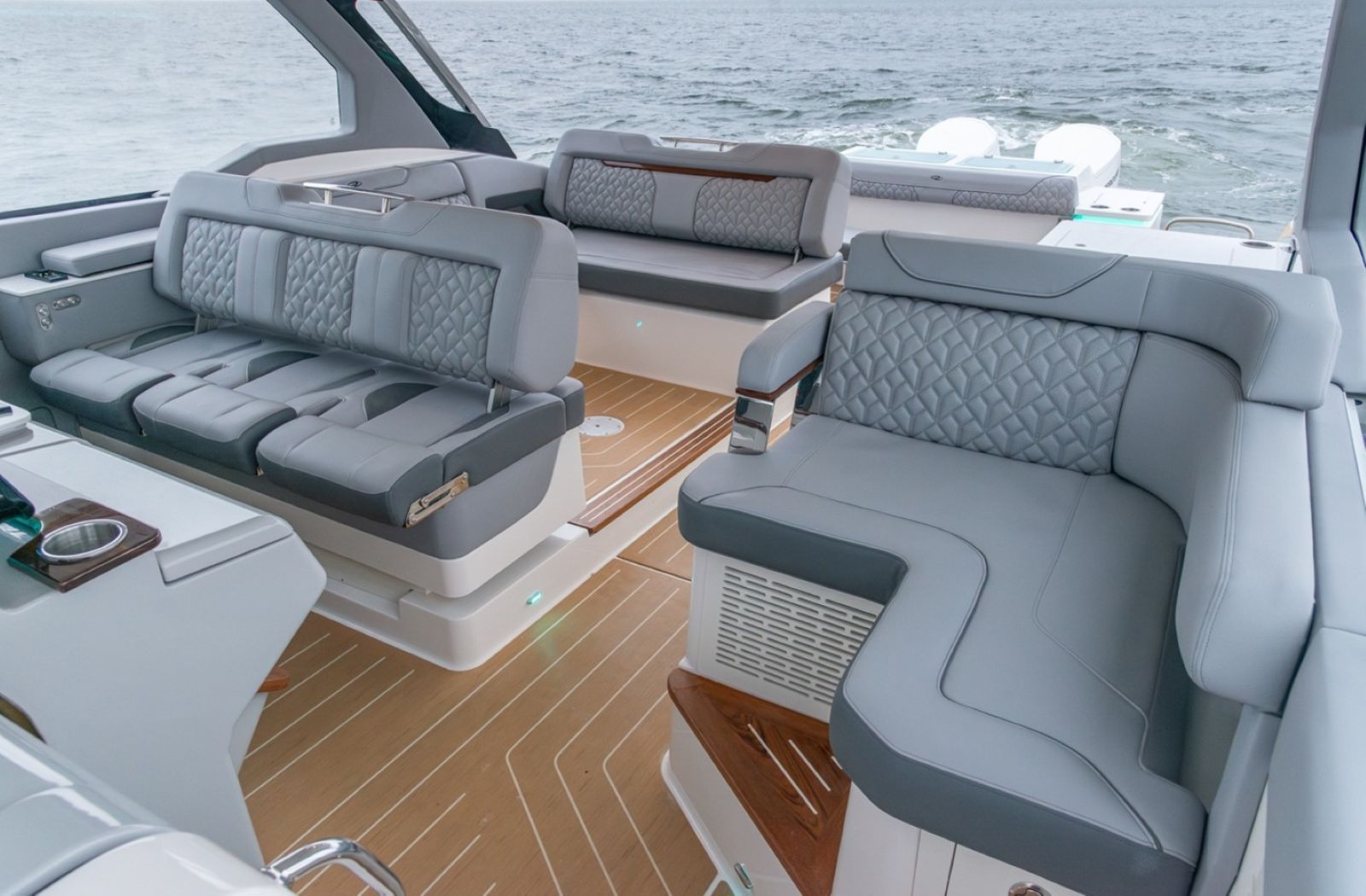 Regal LX43 helm seating and additional seating includes lounge to port and cockpit bench to starboard