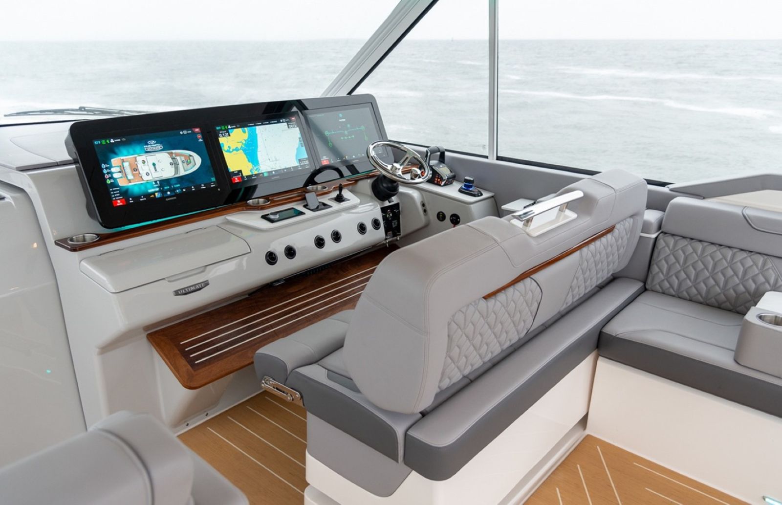 Regal LX43 starboard helm with large bolstered, three person bench