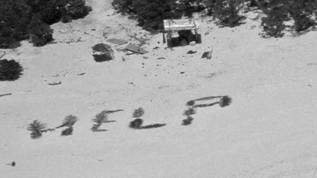 Three men rescued off island due to beach 'HELP' sign