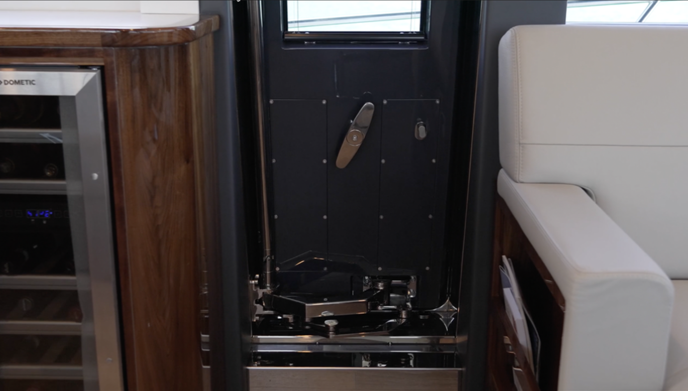 Riviera 58 SMY The sturdy, water-tight door from the salon to the port rail