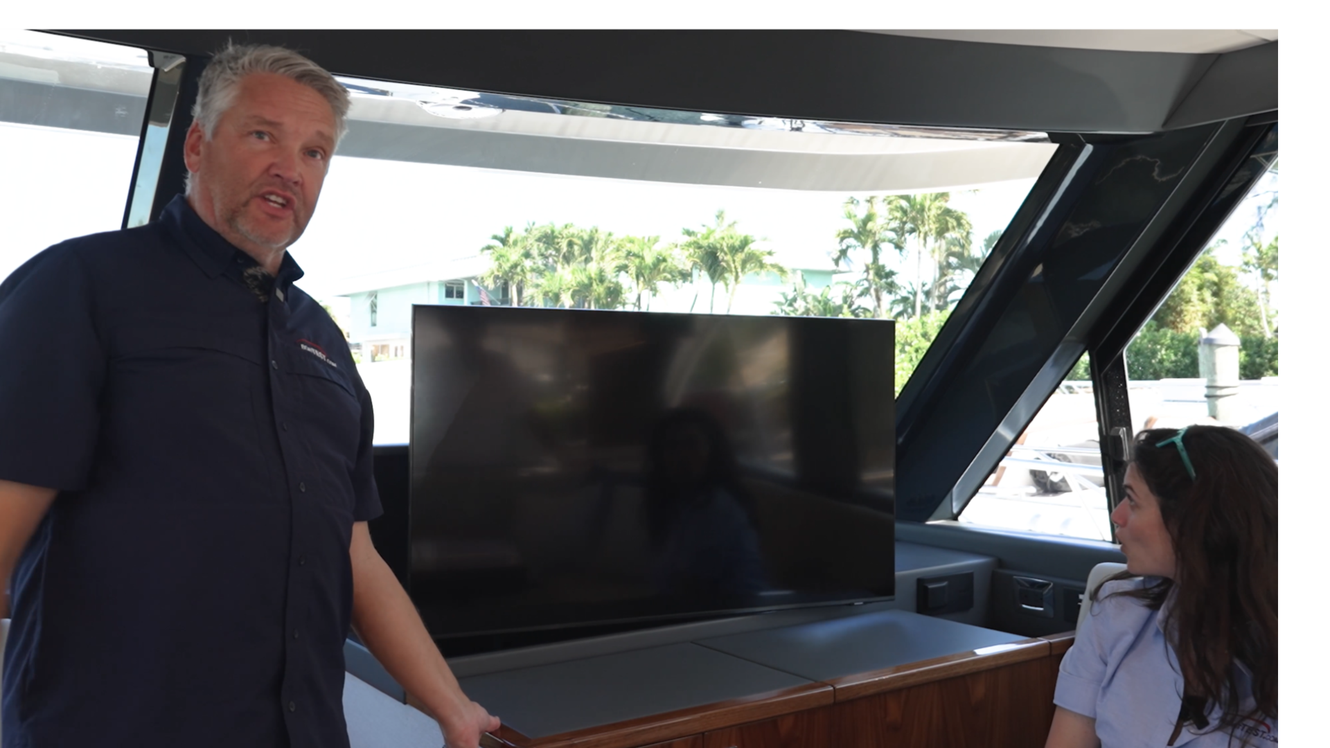 Riviera 58 SMY Captain Gregg showing Captain Boomies the raising and rotating TV