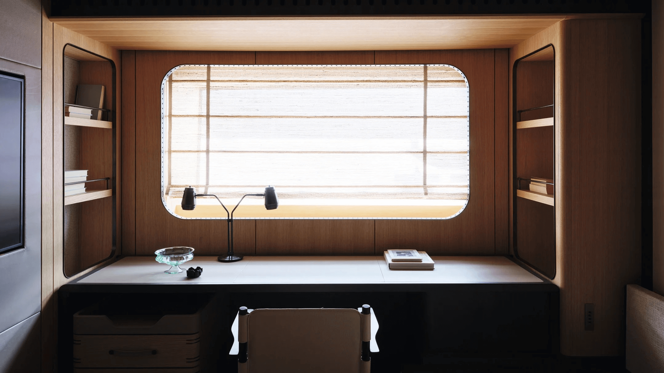 Rossinavi's 59m explorer yacht Akula VIP cabin has a desk under a rectangular window