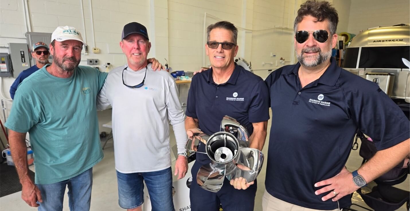 Scott Porta, Capt. Red, Jim Burns, and Greg Sharrow in Detroit, about to install the Sharrow X10