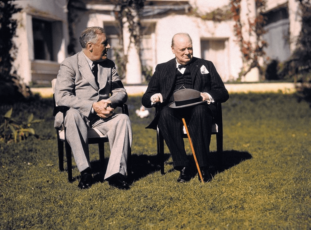 President Roosevelt and Prime Minister Winston Churchill talk on the lawn of the president’s villa