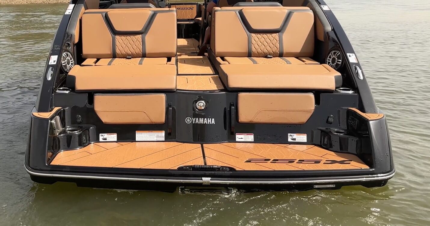 Fully aft, with access to the integrated swim platform and stainless reboarding ladder hidden on the centerline, is this aft-facing seating which slide forward.