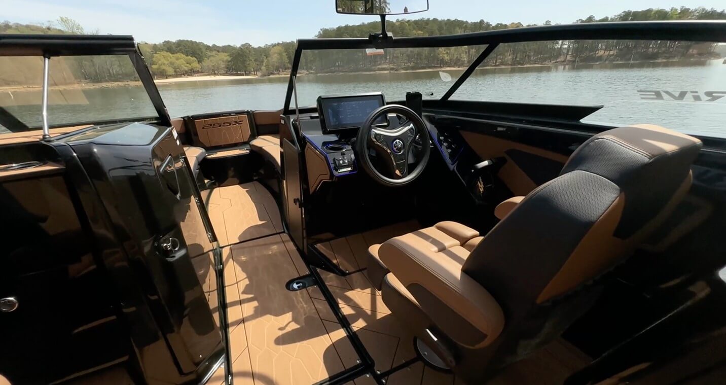 The helm seat is bolstered with arm rests to either side.