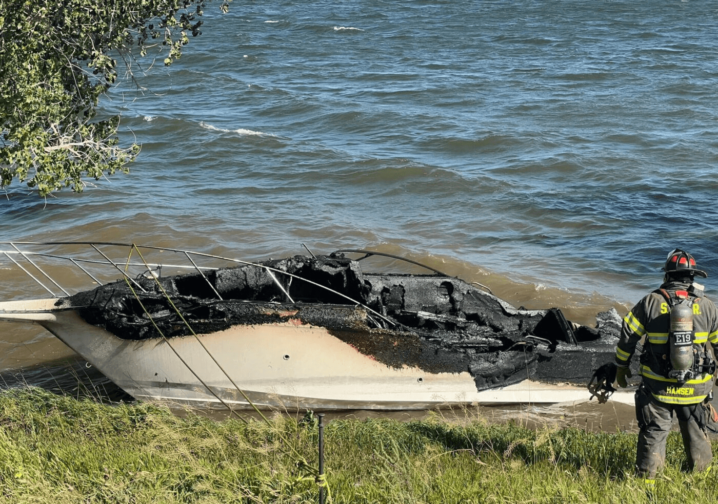 Burned boat near shore