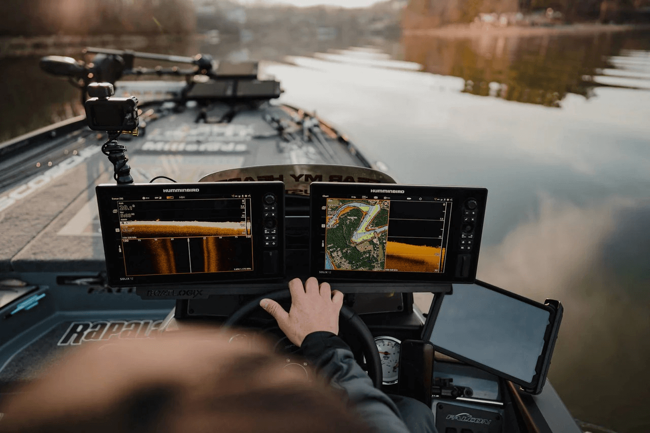 Fish finder on a boat with a person driving