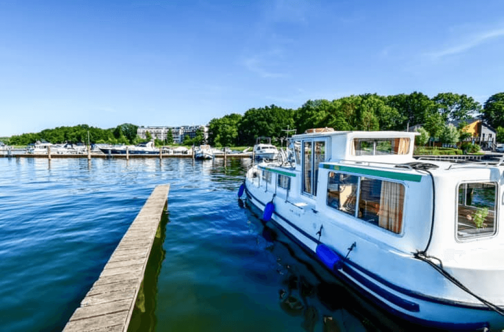 houseboats and yachts are moored in Goehren-Lebbin Germany