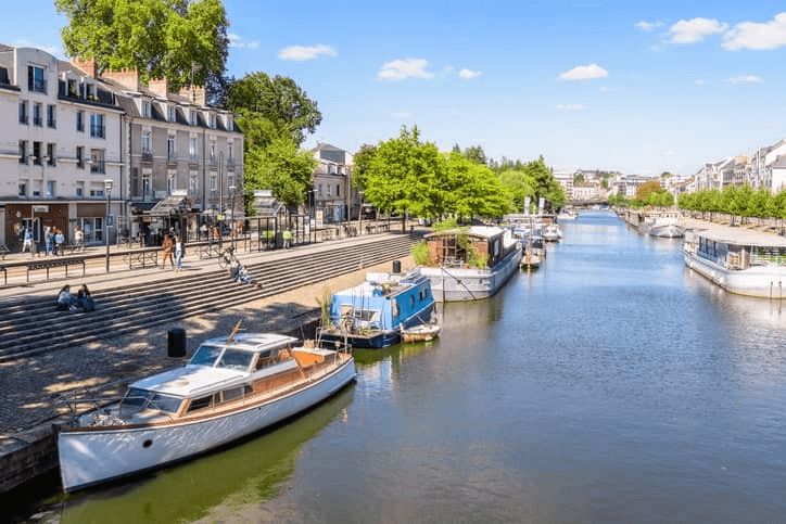 houseboats and boats moored on the river Erdre in Nantes France