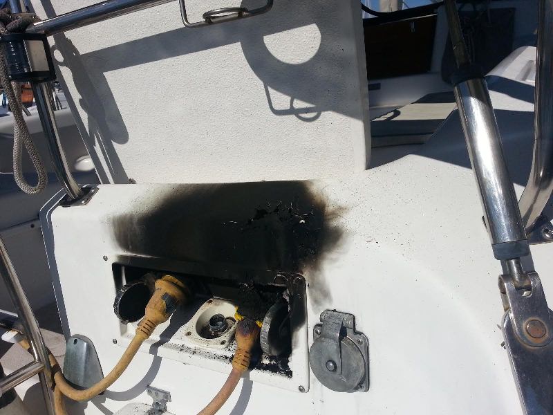 shorepower plug fire, charred boat outlet