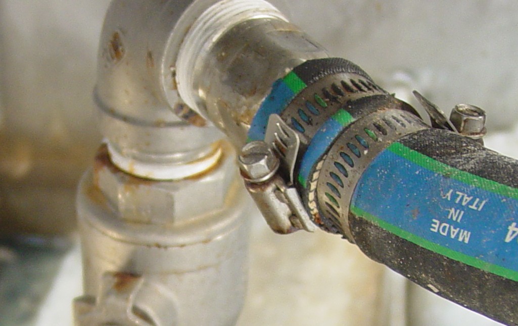 hose crimped by clamp, clamp cutting through hose