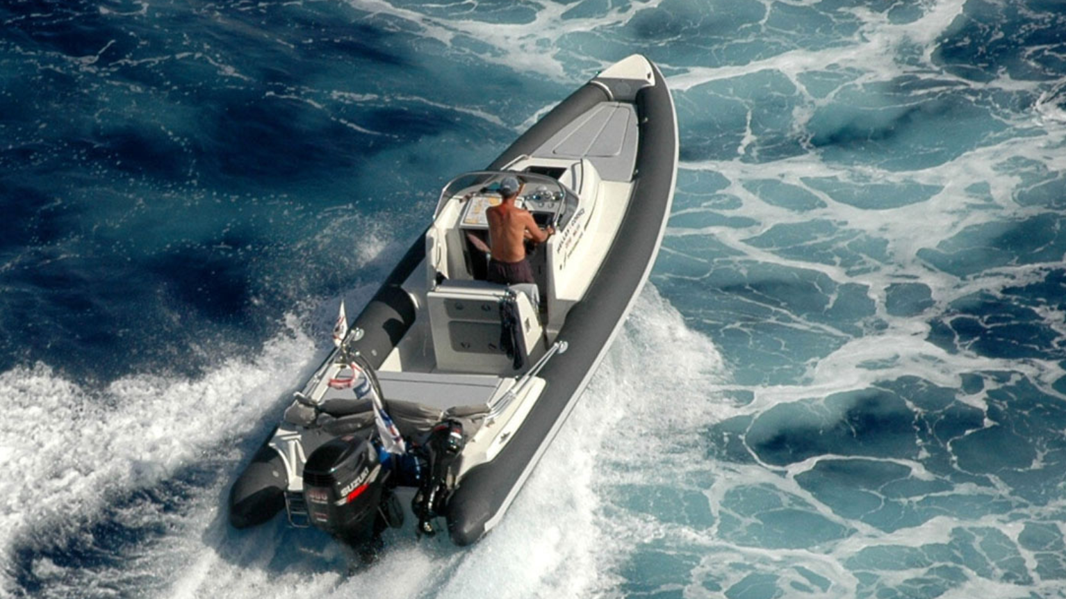 Rigid Hull Inflatable Boat, RIB, running in ocean