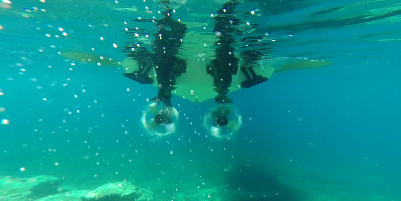 underwater look at propellers, props spinning underwater