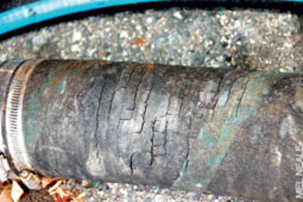 cracked marine hose, deteriorated hose in a boat