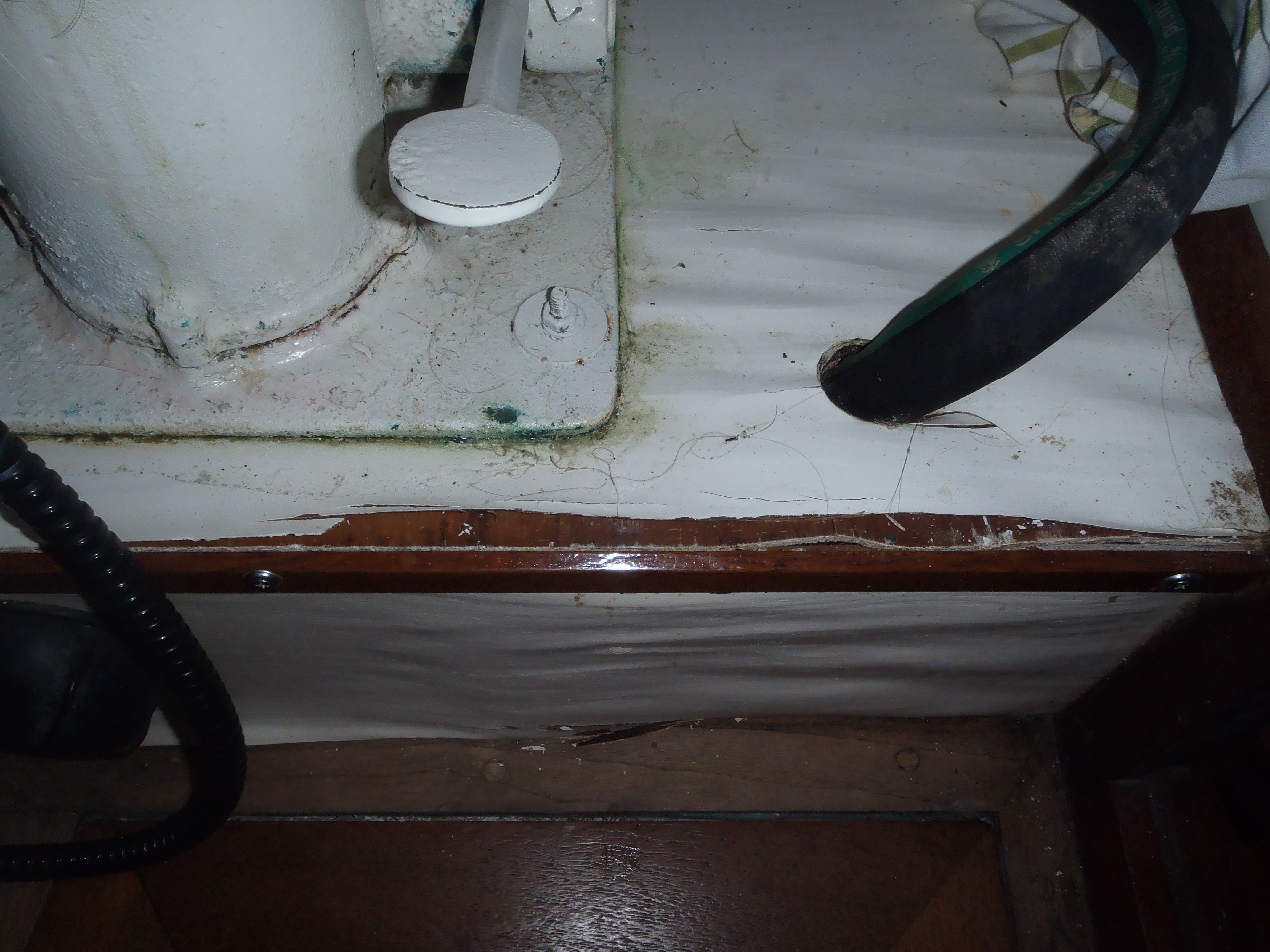 Wood deterioration at the mounting base of this toilet indicates a leak