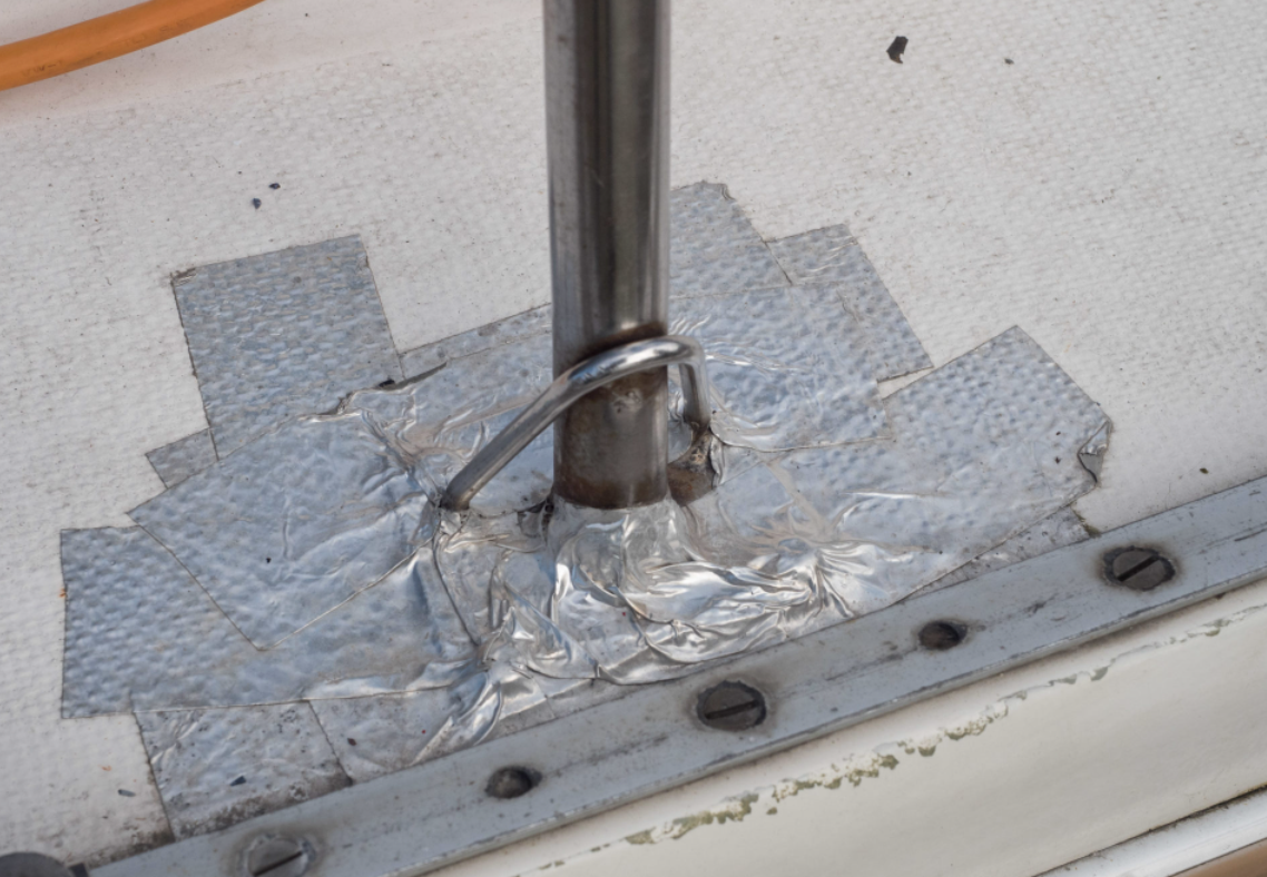 leaking deck stanchion, taped up deck stanchion