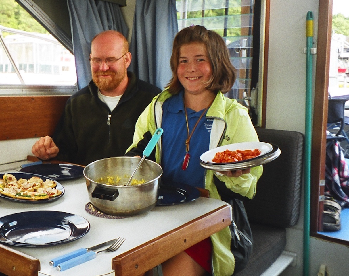 family eating on a boat, yacht dinette