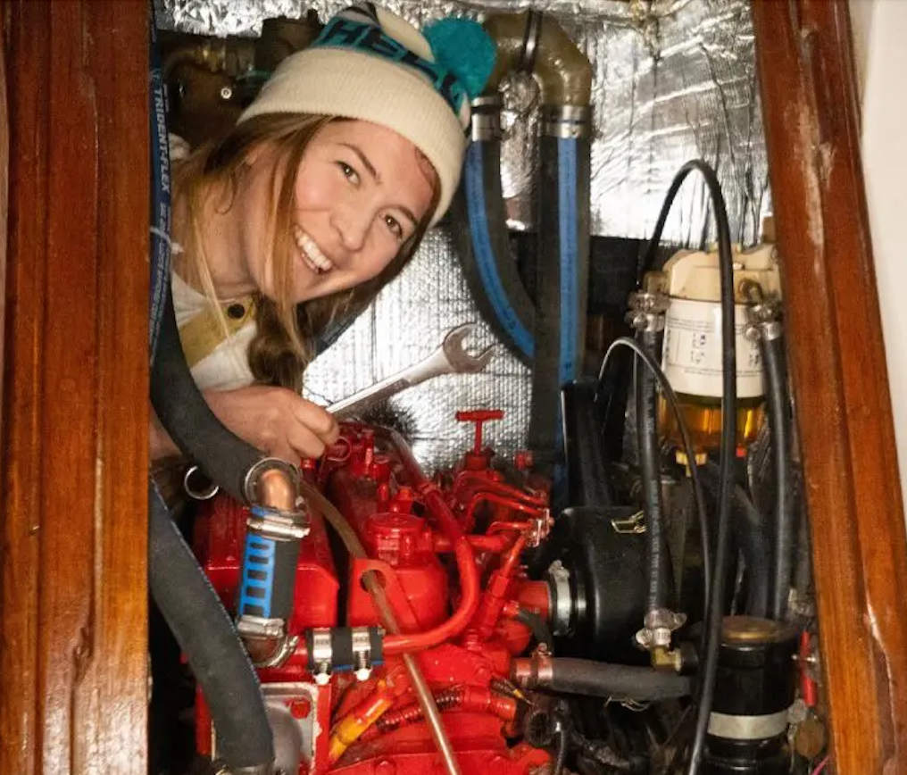 woman in engine room, sailboat engine room