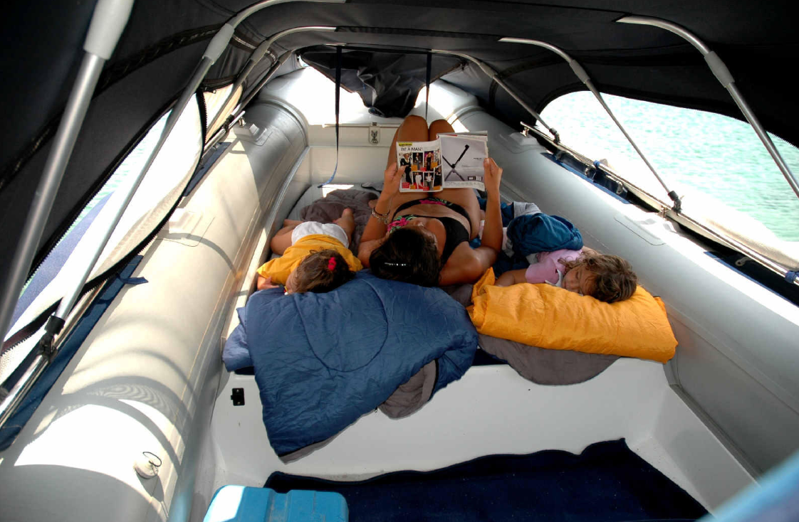 bow tent on a RIB, kids napping on a boat