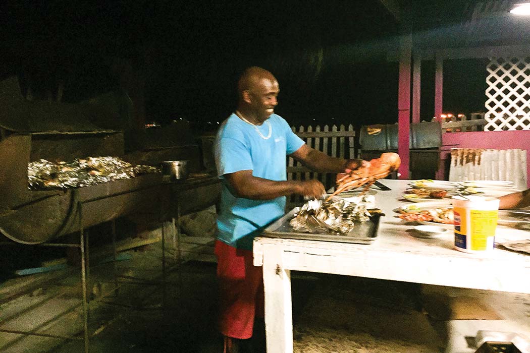 Sacko Sam from Potter’s By The Sea on Anegada Island prepares a succulent dinner of monster lobster.
