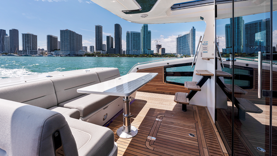 The cockpit area's wide open spaces and close proximity to both aft grill and salon galley forward through glass sliding doors, offer many dining opportunities.