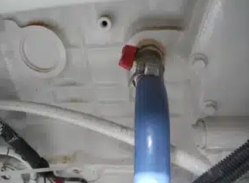 Blue heater hose with red valve returning to the engine.