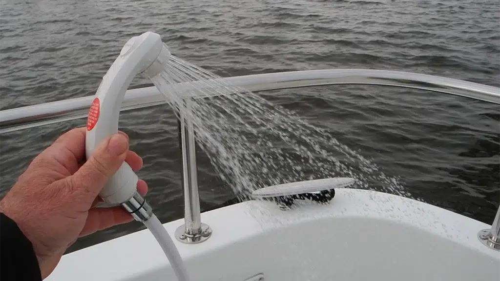 Aft deck freshwater shower sprays while the boat is in open water