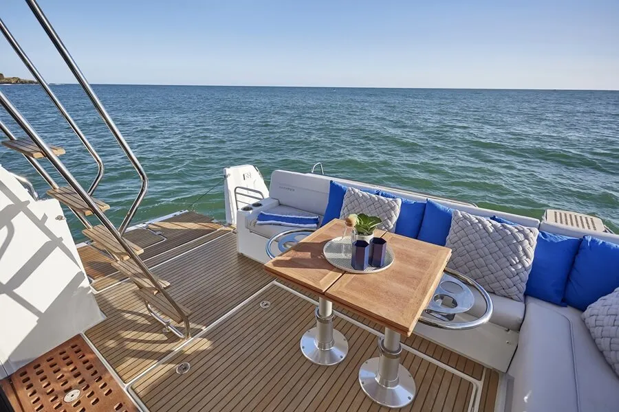 Beneteau's Antares 12 cockpit table can fold out for dining or be lowered to create a sunpad