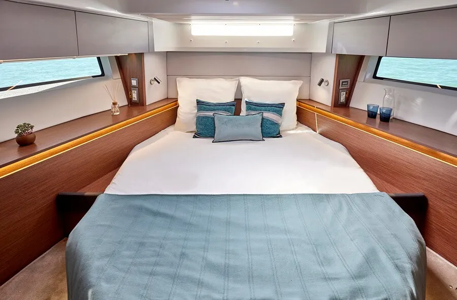 Beneteau's Antares 12 both sides of the master cabin have overhead lockers, a cupboard and a long hull window, plus there's a forward window and a skylight
