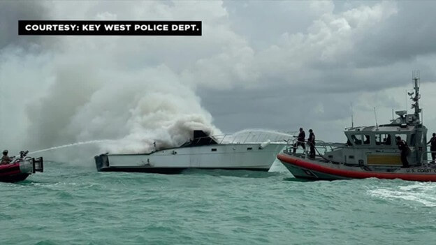 Boat in Key West being extinguished by fire boats