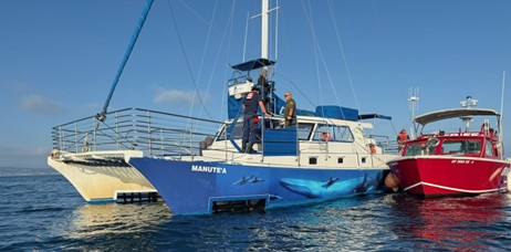 Catamaran being rescued