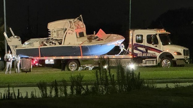 Crunched boat on a tow truck