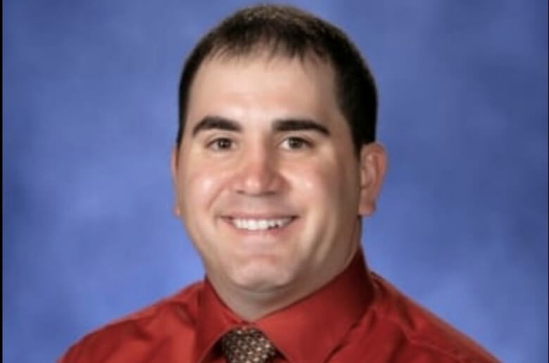 Man in a red shirt and tie