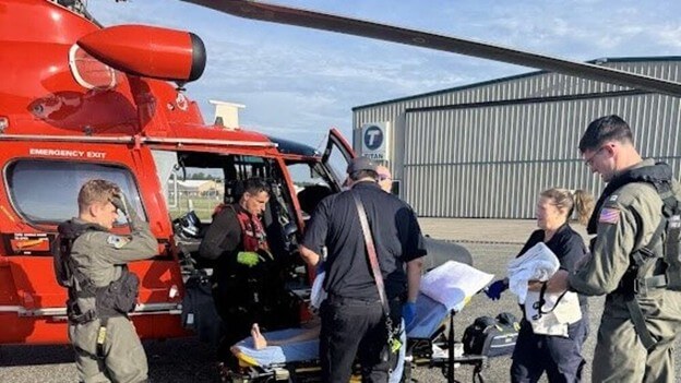 A Coast Guard helicopter hoisted a 52-year-old man out of Lake Huron after his sailboat capsized