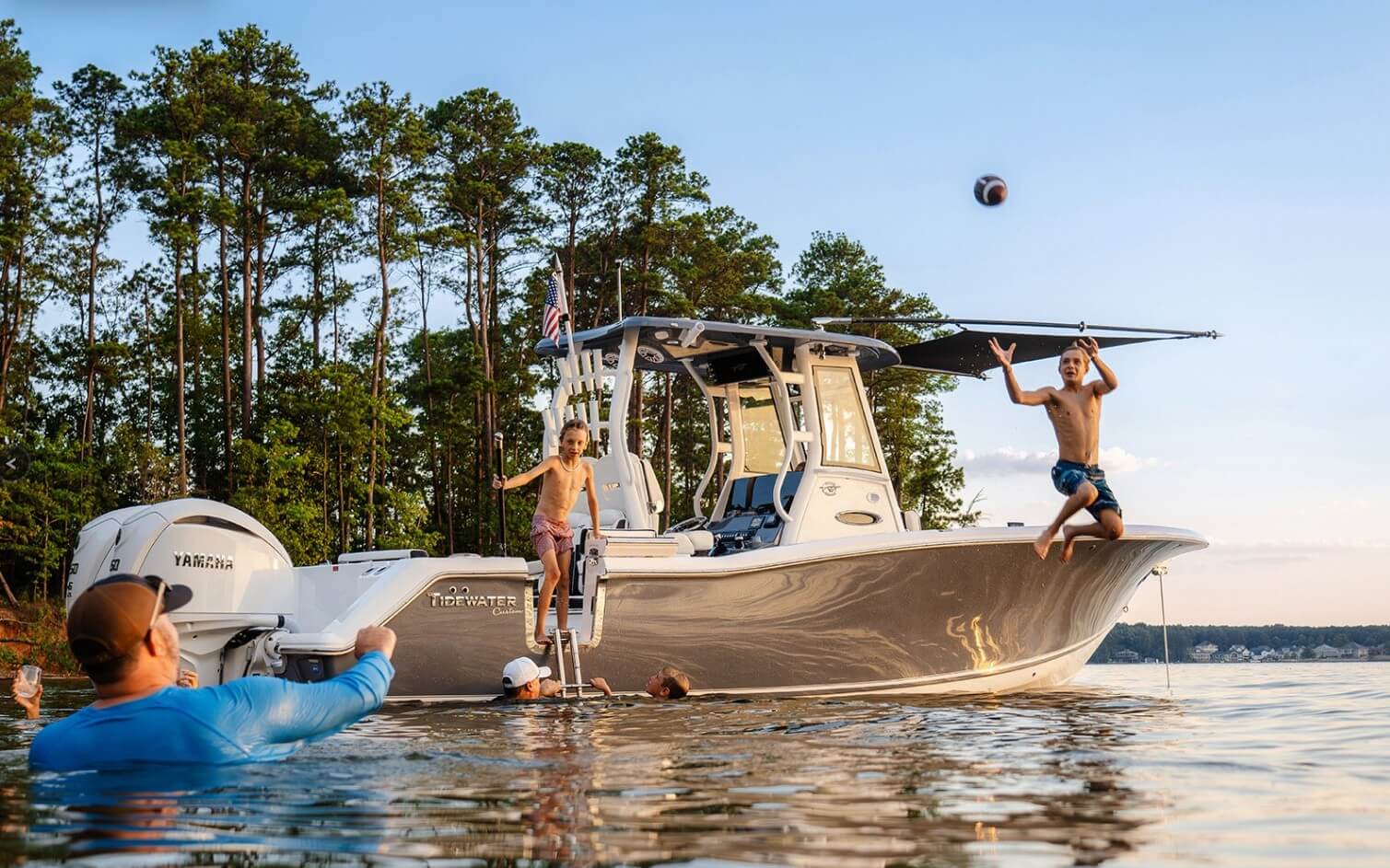 Tidewater 282 CC Adventure Bluewater with kids jumping off it